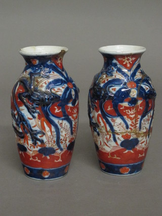 A pair of Japanese Imari porcelain vases of club form 7", f and r,