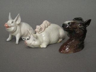 A Beswick wall mask in the form of a horses head 4" and 2  Beswick figures of a reclining and seated pig 6" and 4"