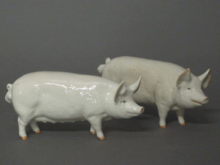 A Beswick figure of a standing white pig, the base marked CH  Wall CHBO and a do. standing white sow the base marked   Champion Wall Queen 2 1/2"