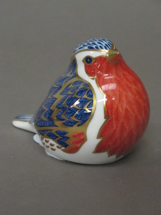 A Royal Crown Derby paperweight in the form of a sleeping  bird, second,