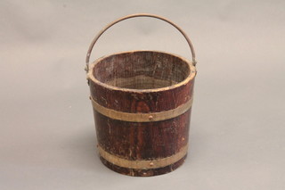 A coopered oak bucket with brass swing handle 12"