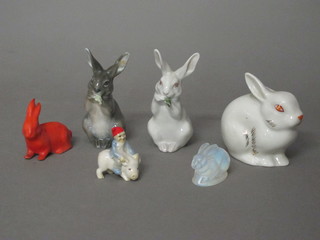 A glass figure of a rabbit, the base signed 1 1/2" together with 4 other figures of rabbits and a figure of an Elf riding a pig