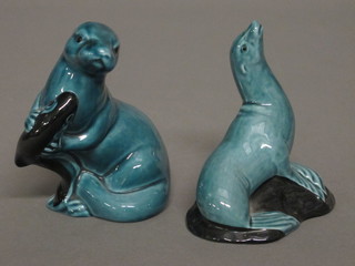 2 blue glazed Poole Pottery figures of sea lions 4"
