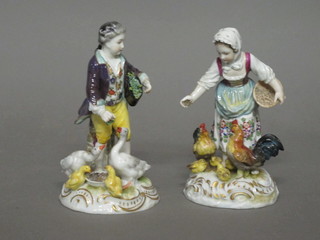 A Continental porcelain figure of a standing lady feeding  chickens and do. gentleman feeding geese 5"