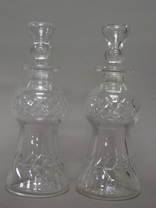 A pair of cut glass thistle shaped decanters and stoppers 12"