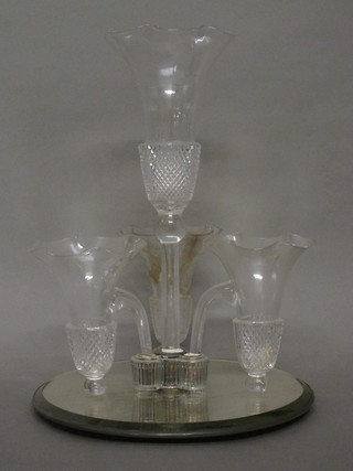 A thistle shaped glass 3 light table centre piece raised on a  mirrored base, 1 light f, 14"
