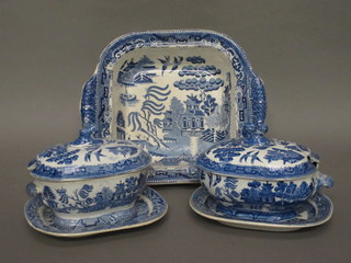 A blue and white Willow pattern twin handled bowl, cracked,  and 2 twin handled sauce tureens and stands