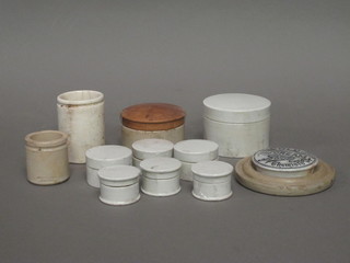 A collection of old toothpaste pots