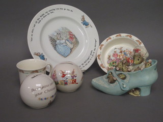 2 Royal Doulton Bunnykins globular shaped money boxes, do. bowl., do cup, a Wedgwood Peter Rabbit plate and a figure of  the Old Woman Who Lived in a Shoe