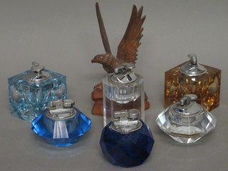 A carved wooden figure of an Eagle 7" and 6 various glass table lighters