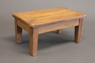 A rectangular pine footstool raised on square tapering supports 15"