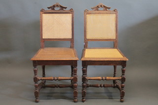 A set of 6 Continental carved oak dining chairs with woven cane  seats and backs, raised on turned and block supports