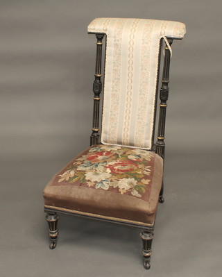 A Victorian ebonised Prie Dieu chair with upholstered Berlin tapestry seat and back