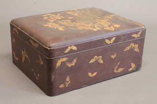 A 19th Century rectangular Oriental lacquered box decorated a  fabulous bird, the interior fitted a tray 15"