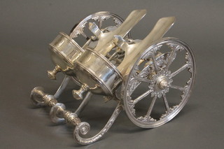 An impressive silver plated 2 bottle gun carriage bottle coaster, 13"