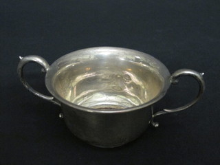 A silver twin handled dish, marks rubbed, 4 ozs