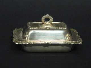 A silver plated butter dish in the form of a miniature entree dish and cover