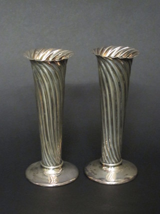 A pair of Victorian reeded silver specimen vases raised on spreading feet, Sheffield 1897, 8 ozs