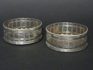 A handsome pair of George III circular pierced silver bottle coasters, London 1818  ILLUSTRATED