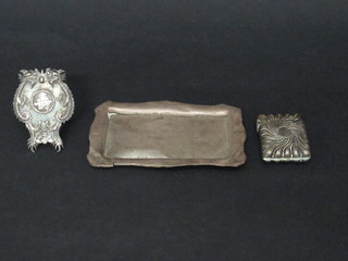 A rectangular silver pin tray 5" - Chester, an Oriental embossed  white metal place card holder and a metal vesta case