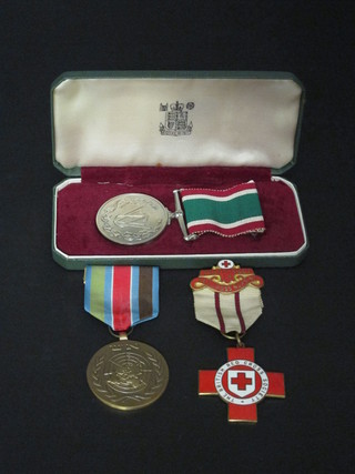 A Woman's voluntary service Long Service medal, boxed, a  United Nation's medal and a British Red Cross medal
