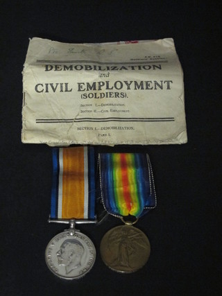 A pair of medals to G S-25819 Pte. C M Smith Royal Fusiliers comprising British War medal and Victory medal together with a  Railway Warrant Certificate of Identity, Pay Allowance book,  Demobilisation and Civil Employment booklet and a Buckingham  Palace letter dated 1918