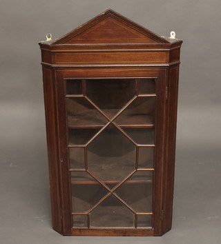 A Georgian inlaid mahogany corner cabinet with moulded  cornice, the interior fitted shelves enclosed by astragal glazed  panelled door 23"