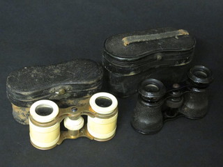 A pair of gilt metal and ivory opera glasses and 1 other pair of  opera glasses
