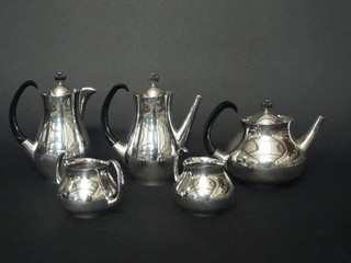A 5 piece silver plated tea service of plain form comprising  teapot, hotwater jug, coffee pot, twin handled sugar bowl and  milk jug by Mappin & Webb