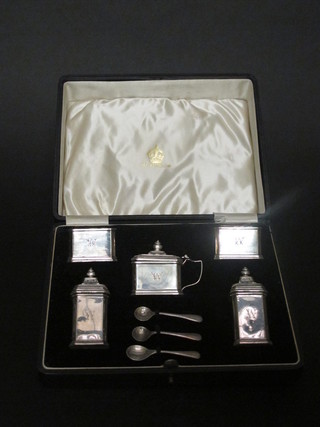 An Elkington's Art Deco silver 5 piece condiment set comprising  pair of salts, pair of peppers, mustard pot and 3 condiment  spoons, London 1940, 4 1/2 ozs, cased, blue glass liner to  mustard pot missing,