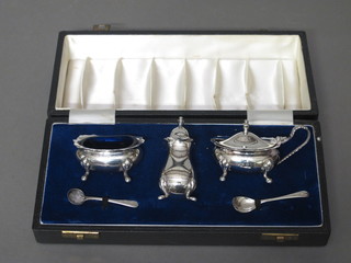A 3 piece silver condiment set comprising mustard, salt and pepper, London 1967, 3 1/2 ozs, cased