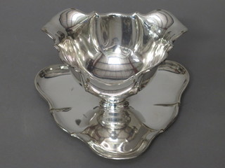 A Continental silver plated triangular shaped sauce boat