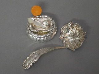 A Continental silver sifter spoon, do. tea strainer - f, and a Continental tea strainer