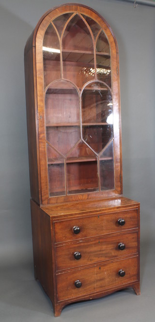 A Georgian bookcase on chest, the arched upper section fitted adjustable shelves enclosed by astragal doors, the base fitted 3  long drawers, raised on bracket feet 28"