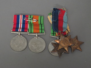 2 1939-1945 Stars, Africa Star, Defence medal and a pair mounted Defence and War medal