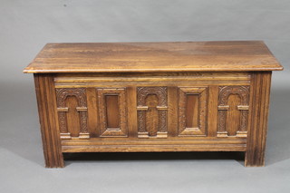 A carved oak coffer with hinged lid 45"
