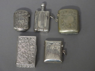 A silver vesta case, a Sterling vesta case, a plated vesta case, a white metal box with hinged lid and a plated lighter