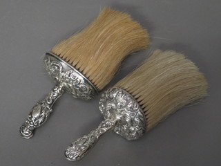 A Victorian silver handled table brush London 1896 and an Edwardian ditto London 1907