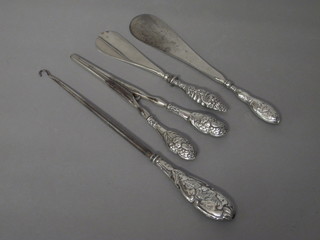 2 silver handled shoe horns, do. glove stretchers and button hook