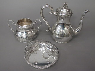 An engraved silver plated coffee pot, do. twin handled cream  jug and a circular pierced silver plated dish