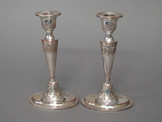 A pair of Adams style silver plated candlesticks 8"