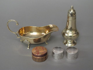 A silver plated sauce boat, a pair of do. napkin rings, do. sugar sifter and a straw work box