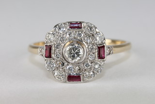 A lady's 18ct yellow gold dress ring set diamonds and baguette cut rubies, approx 0.51ct
