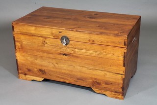 An Eastern hardwood coffer with hinged lid and drop handles  35"