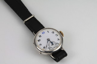 A lady's wristwatch with enamelled dial and Arabic numerals contained in a silver case