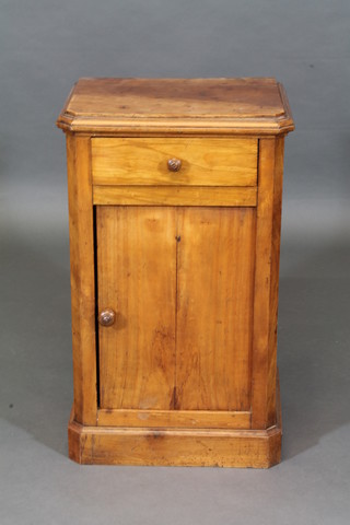 A 19th Century Continental bleached mahogany bedside table fitted a drawer above a cupboard 16"