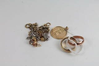 A 9ct gold St Christopher medal, a gilt metal Russian wedding  band and a quantity of various gilt chains