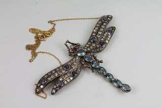 A pendant in the form of a dragonfly set rubies, sapphires,  aquamarine and diamonds approx 3ct