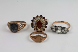 A gold signet ring, a gold dress ring cut and 2 other rings
