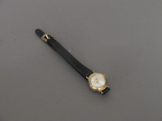 A lady's Corvette wristwatch contained in a gold case